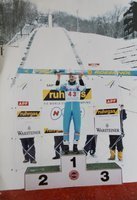 Photo of Adam Malysz on the FIS World Cup Ski Jumping podium