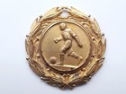 Plaque with a football player, gold-plated with a wreath (old)